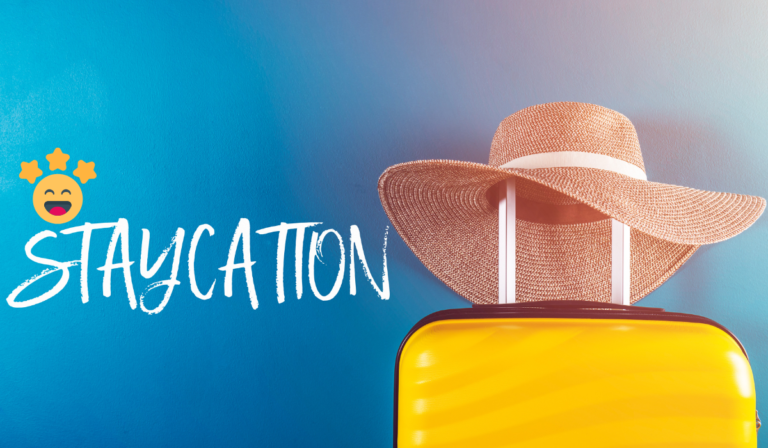 an image containing a traveling bag, hat and a text that reads "Staycation"